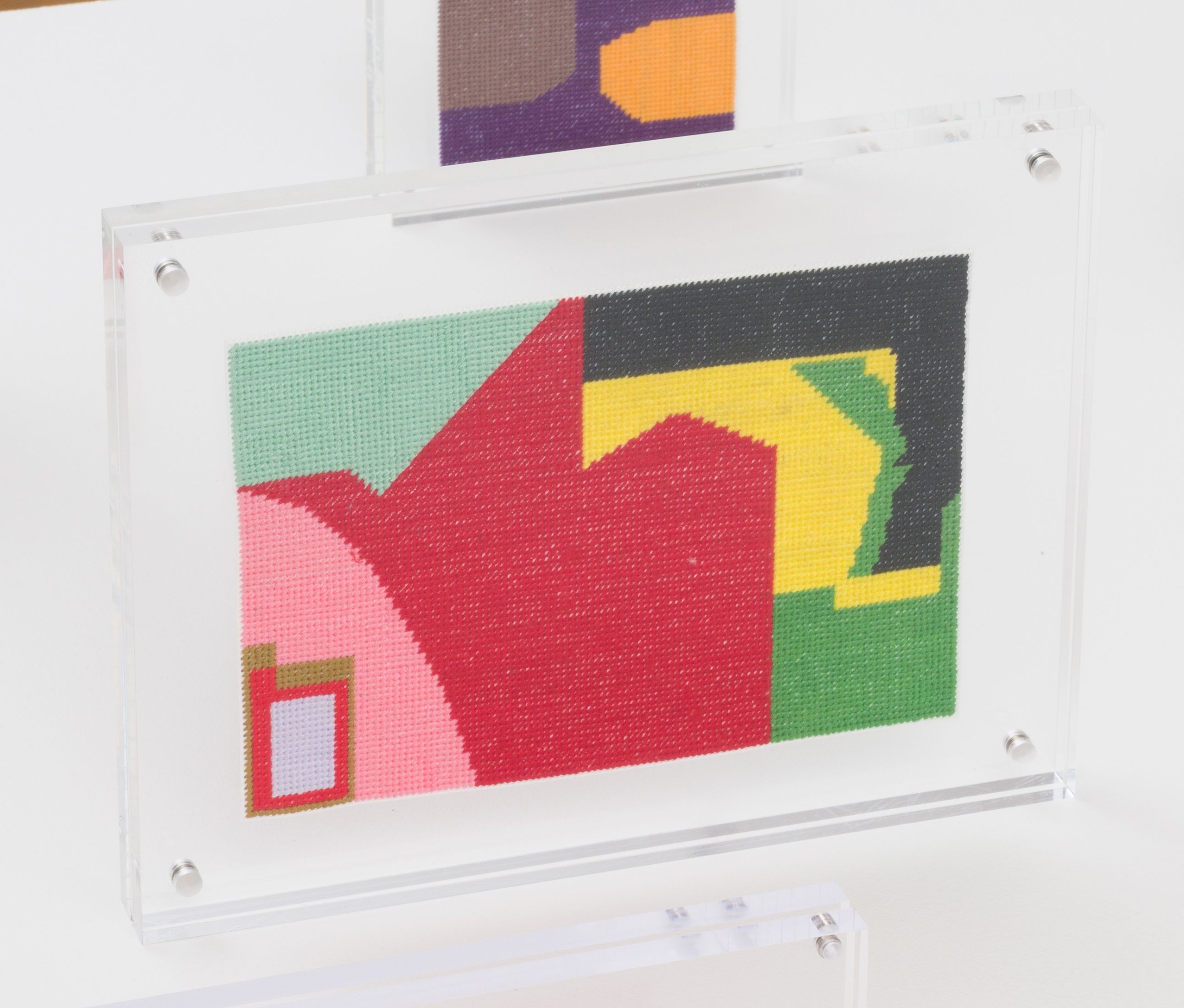 Steve Reinke, Untitled (needlepoint), 2021, floss on plastic backing, 6 x 9 in.
