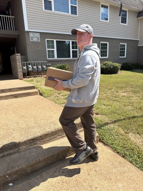 Distributing food boxes to residents.