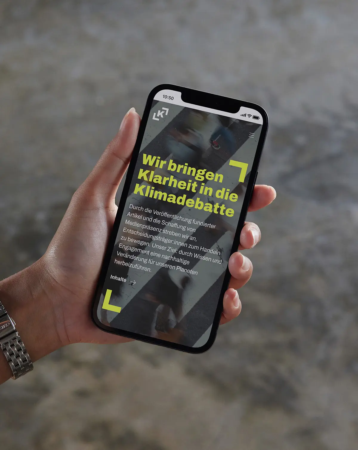 Hand with smartphone showing UI of context website