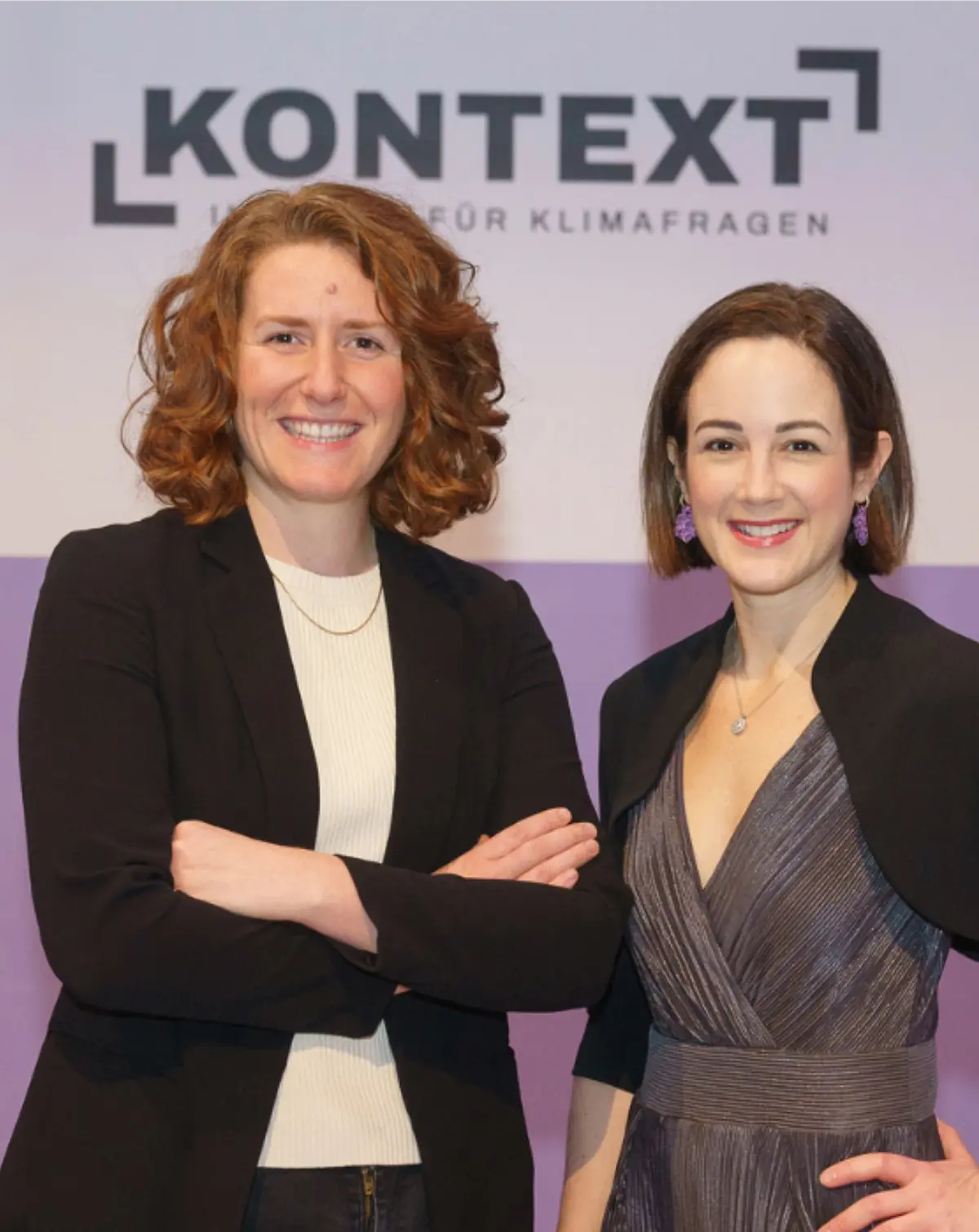 Two women in portrait during a panel discussion