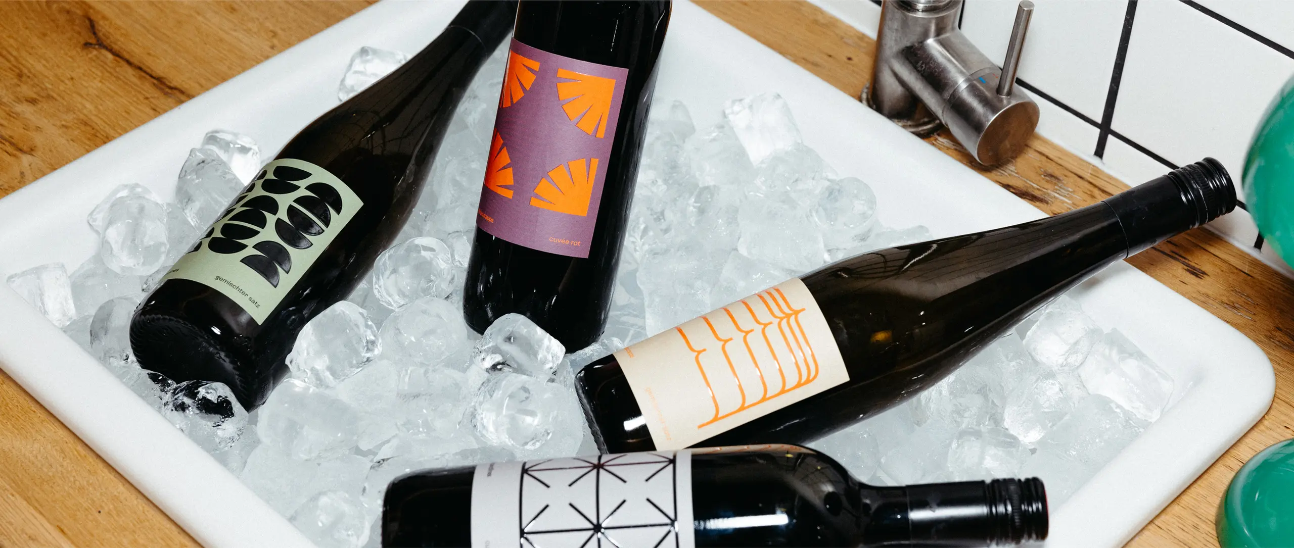 Wine bottles with striking label in ice tub