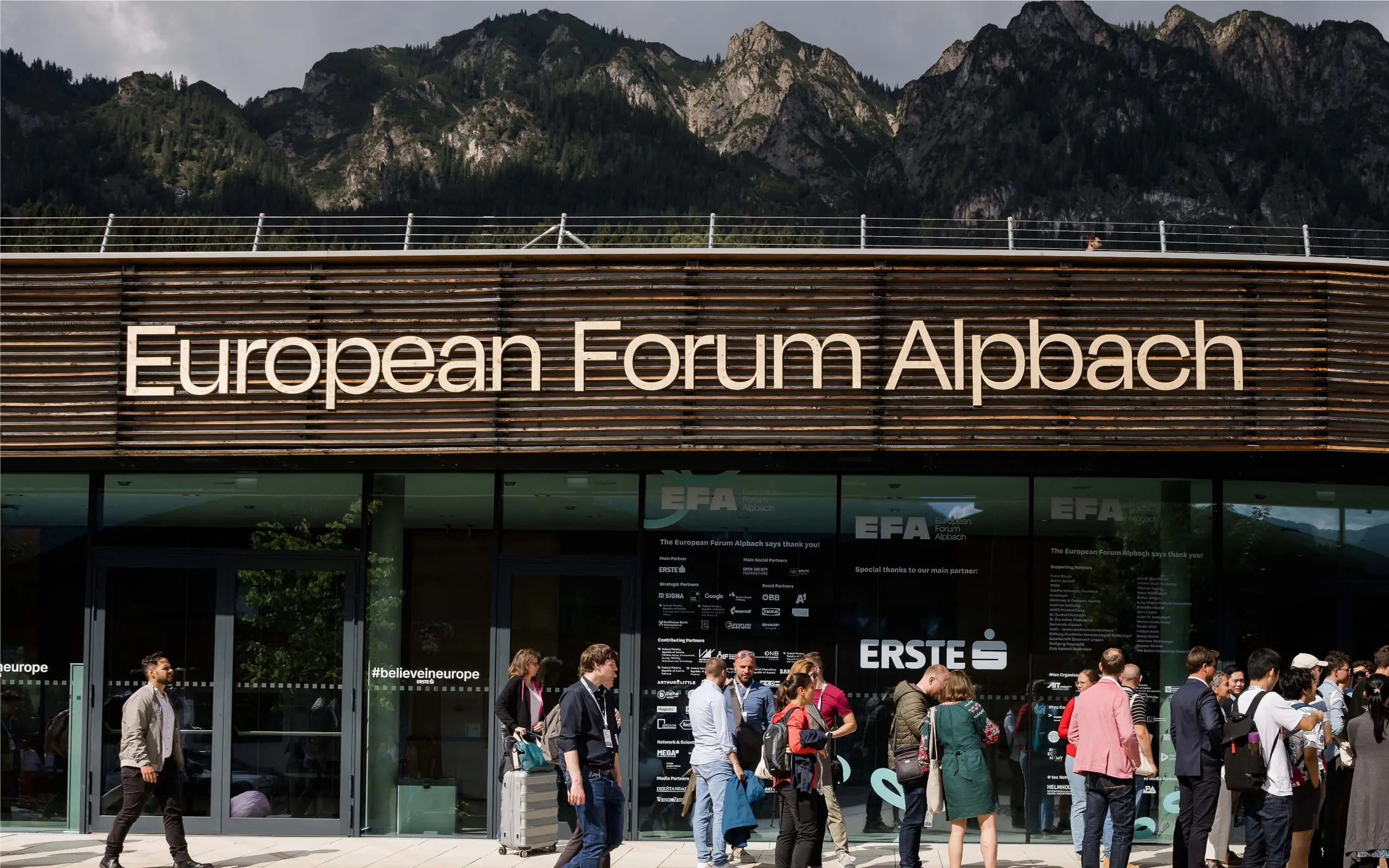 People entering the venue of the forum