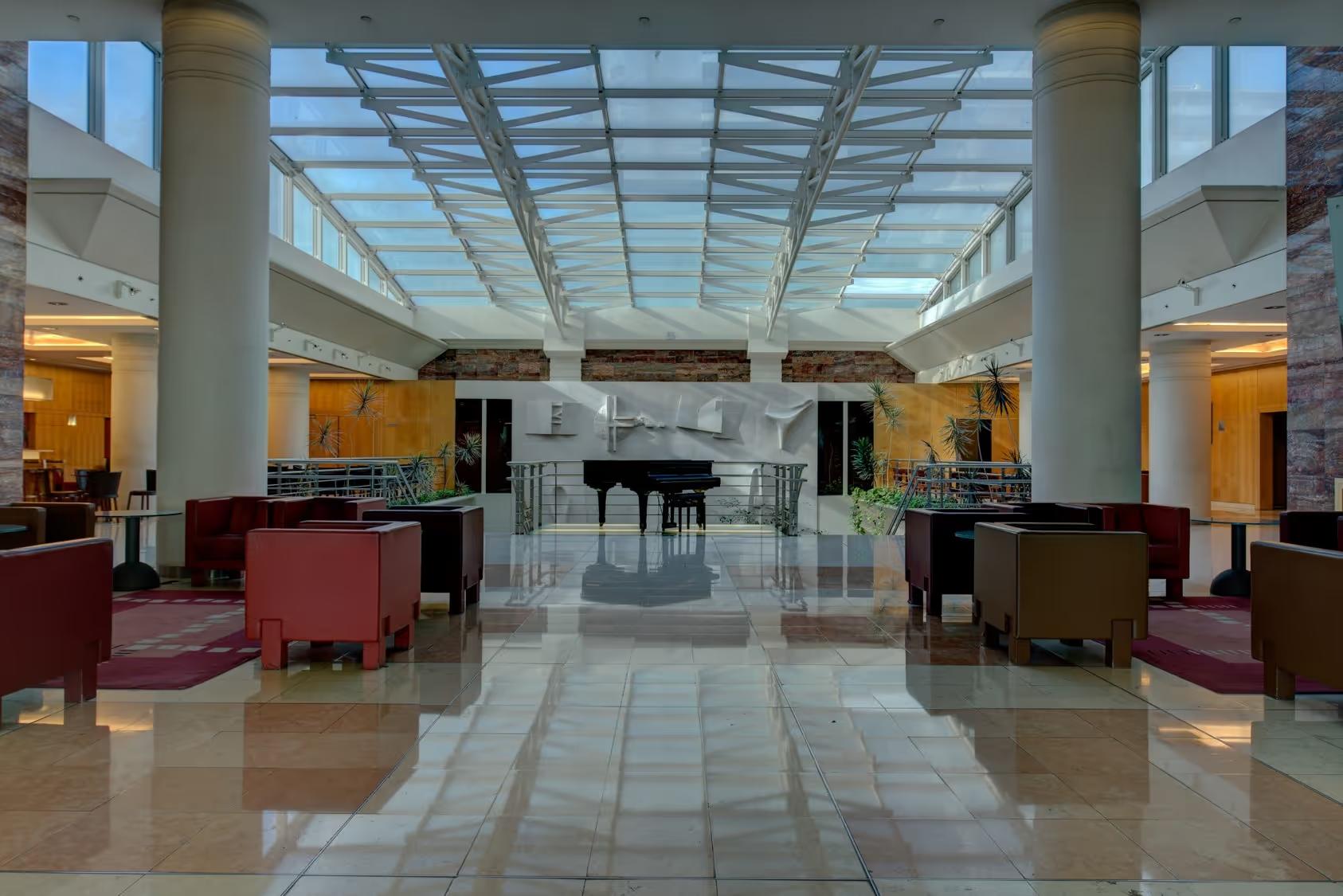 Glass-roofed lobby of the VIP Executive Entrecampos Hotel