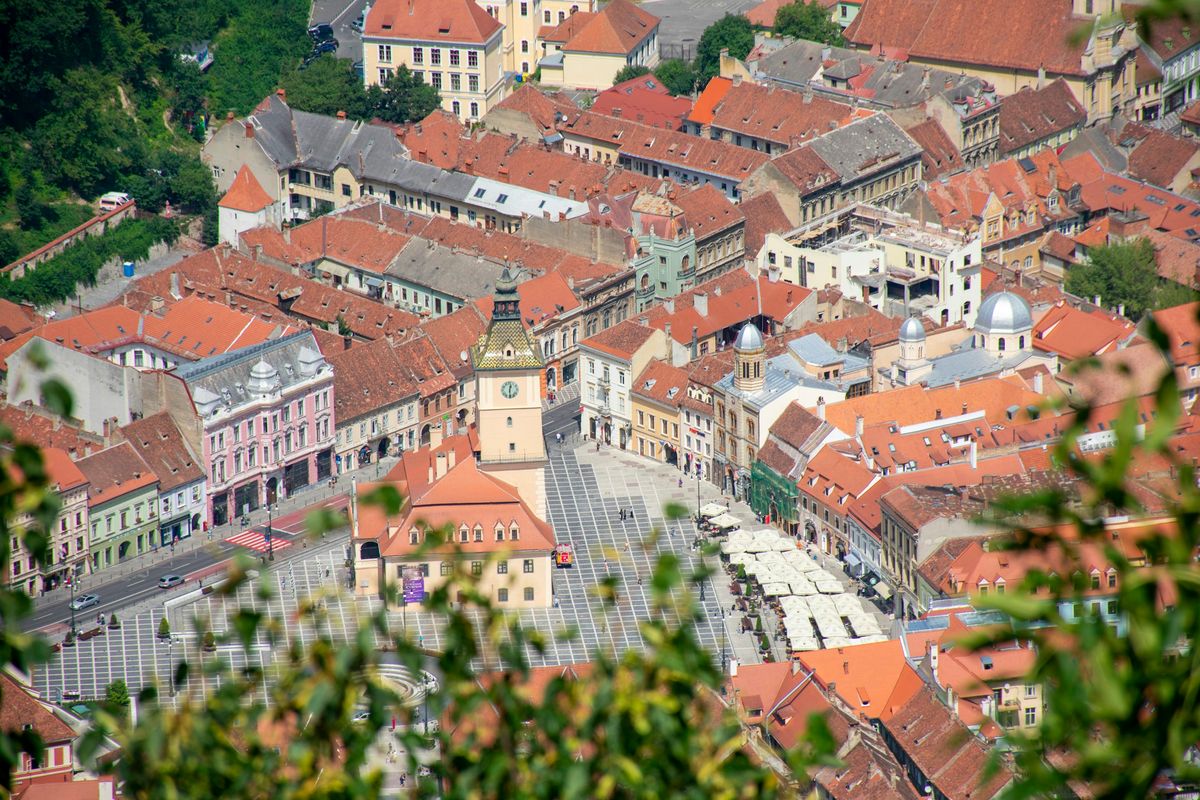 The red rooftops of Brașov’s old town seen from above.