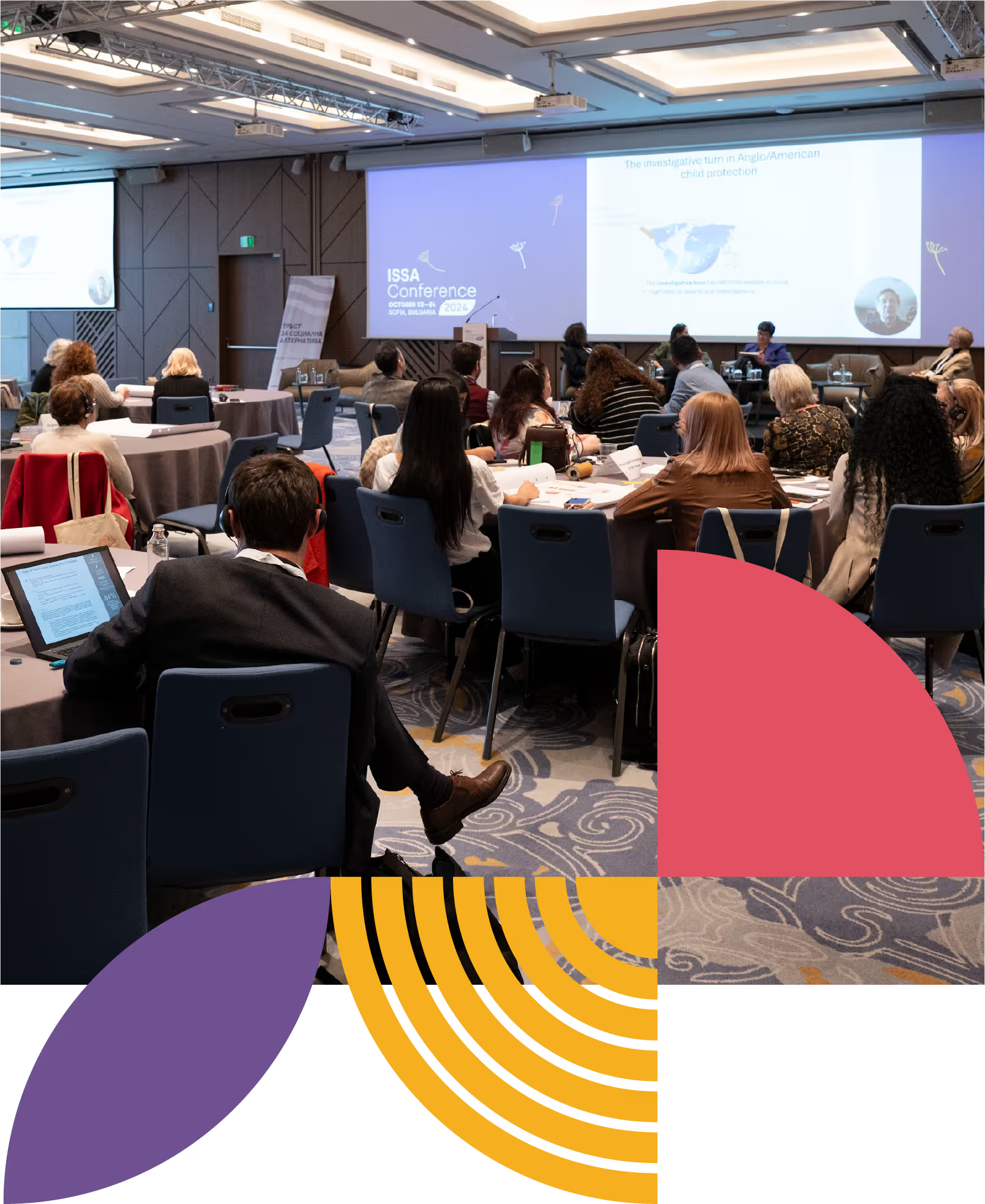 Participants listening to a presentation at a conference