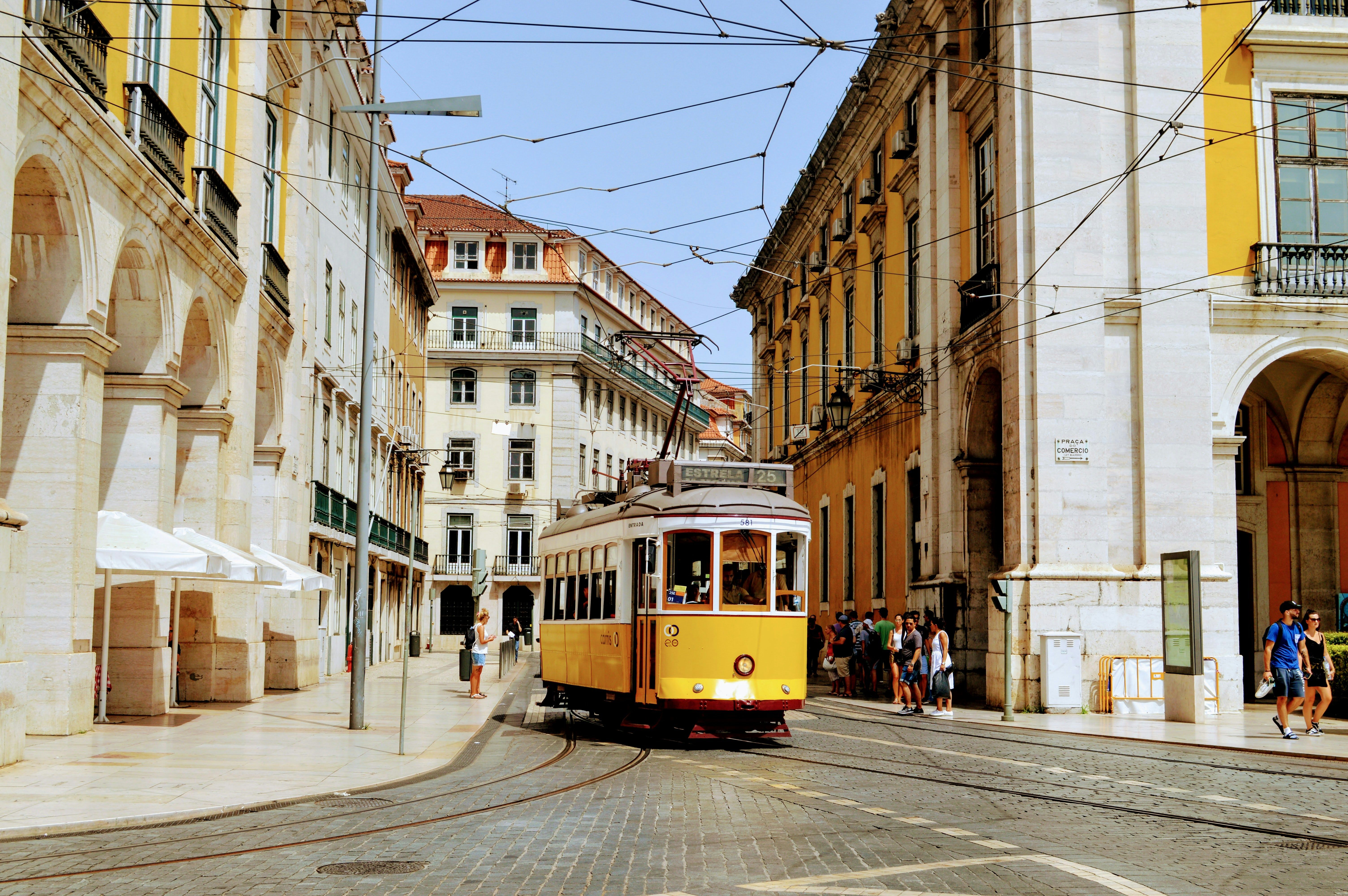 Yellow tram on a street in central Lisbon