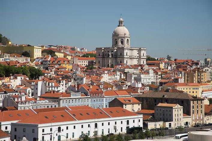 View over Lisbon's red rooftops to a domed church