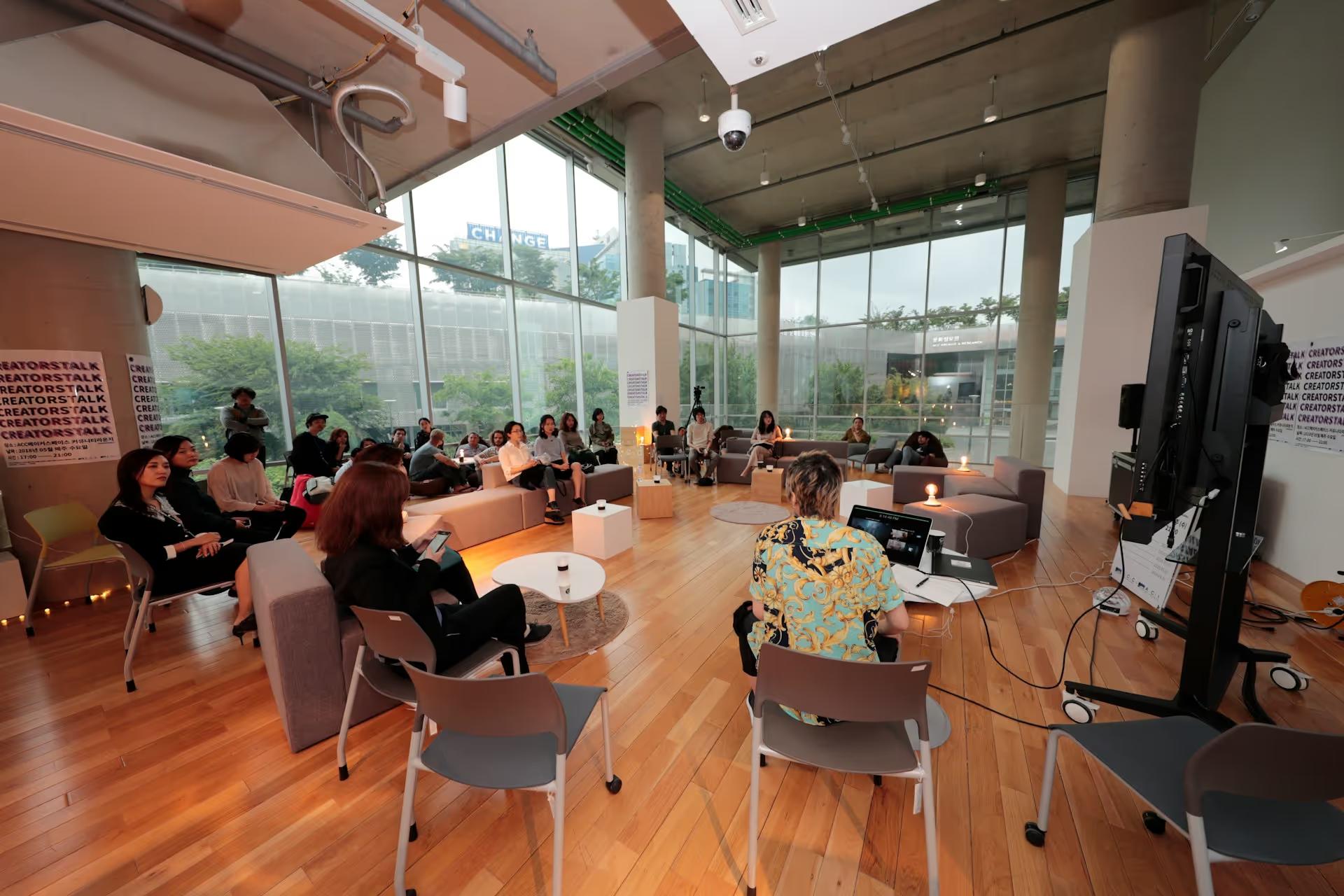Large group gathered in a bright meeting space