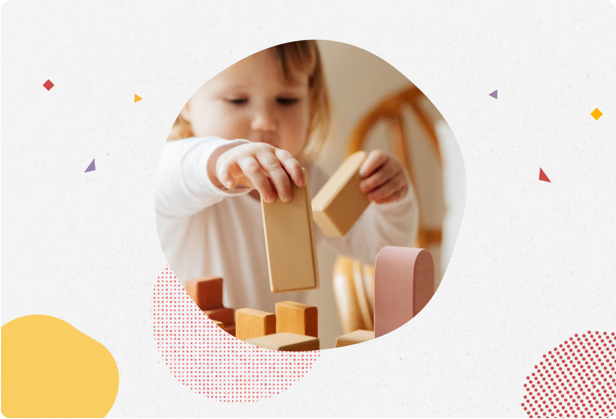 Toddler stacking wooden blocks
