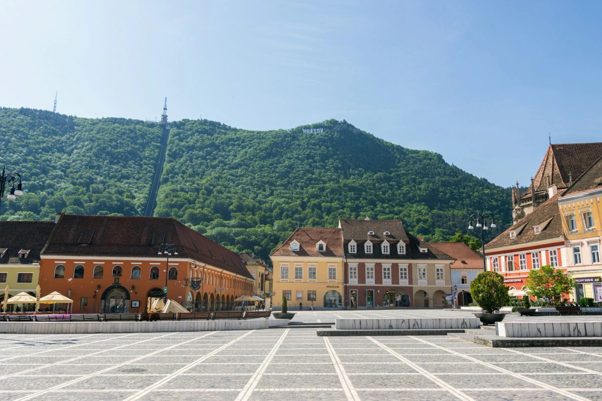 The Council Square in Brașov, Romania, with Tâmpa mountain behind.