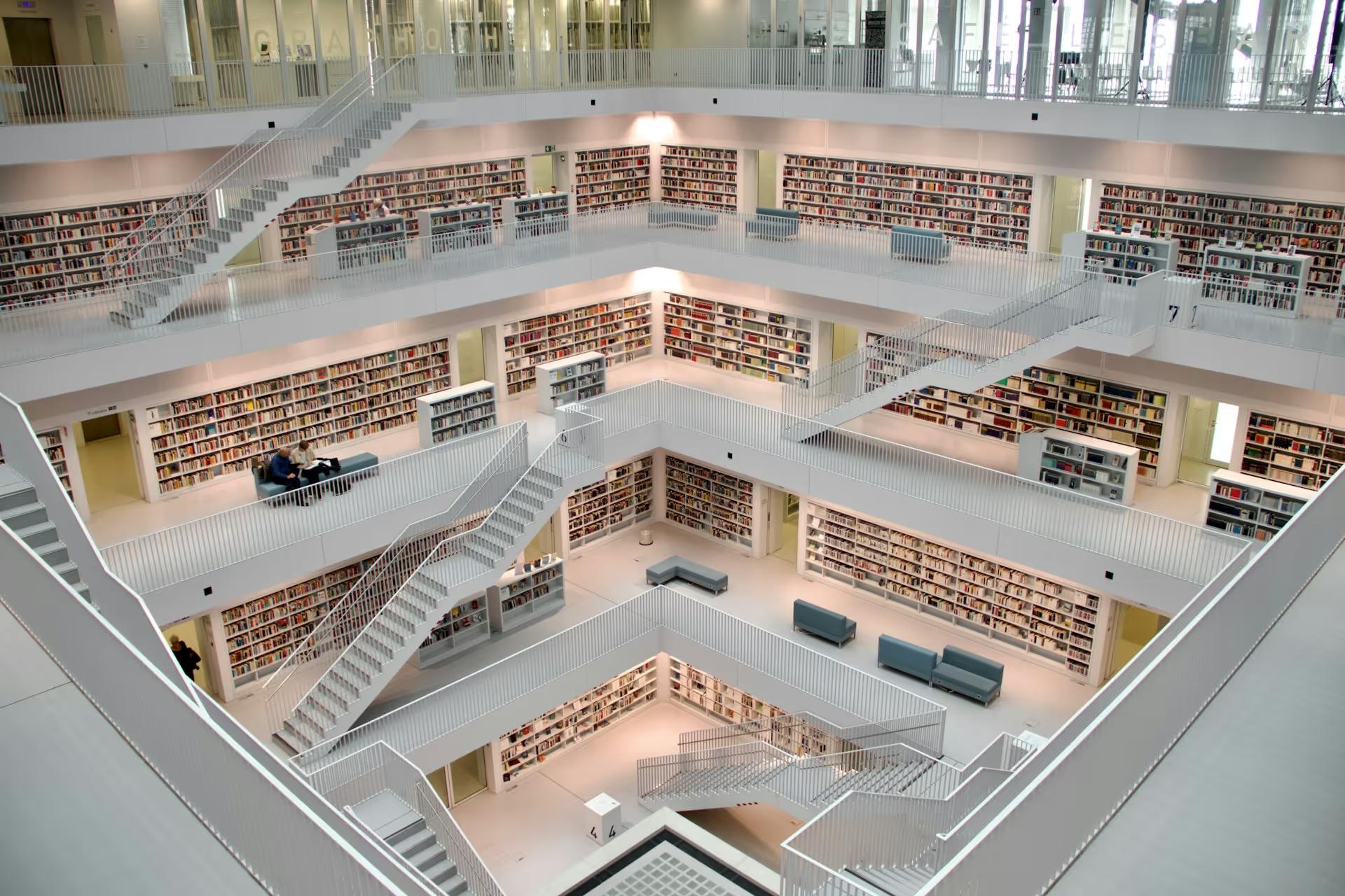 Multi-level library atrium lined with bookshelves