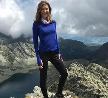 Veronika Kanova today, standing on a mountain summit