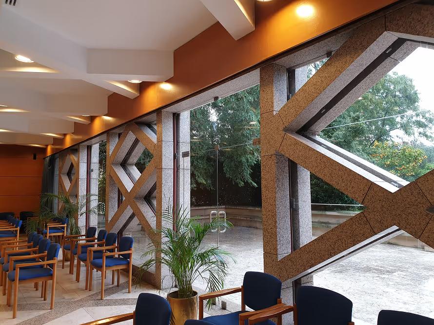 Seating area beside large windows at one of the conference venues