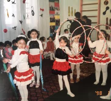 Narmin Makhmudzade as a child, performing with hoops in kindergarten