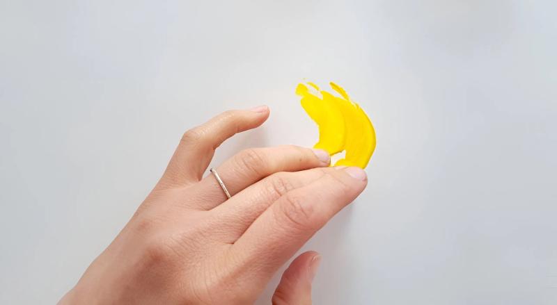 Hands with yellow element