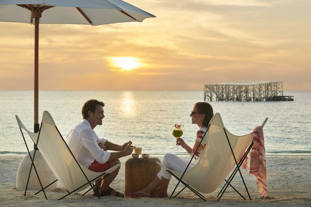 Couples on bech sunset