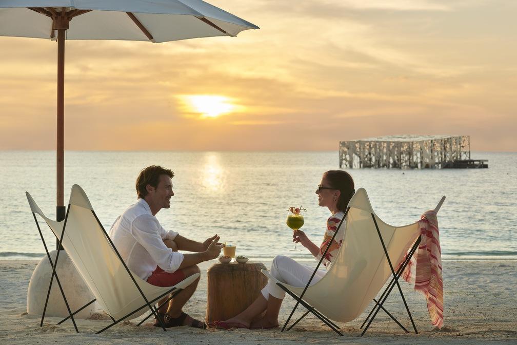 Couples on bech sunset