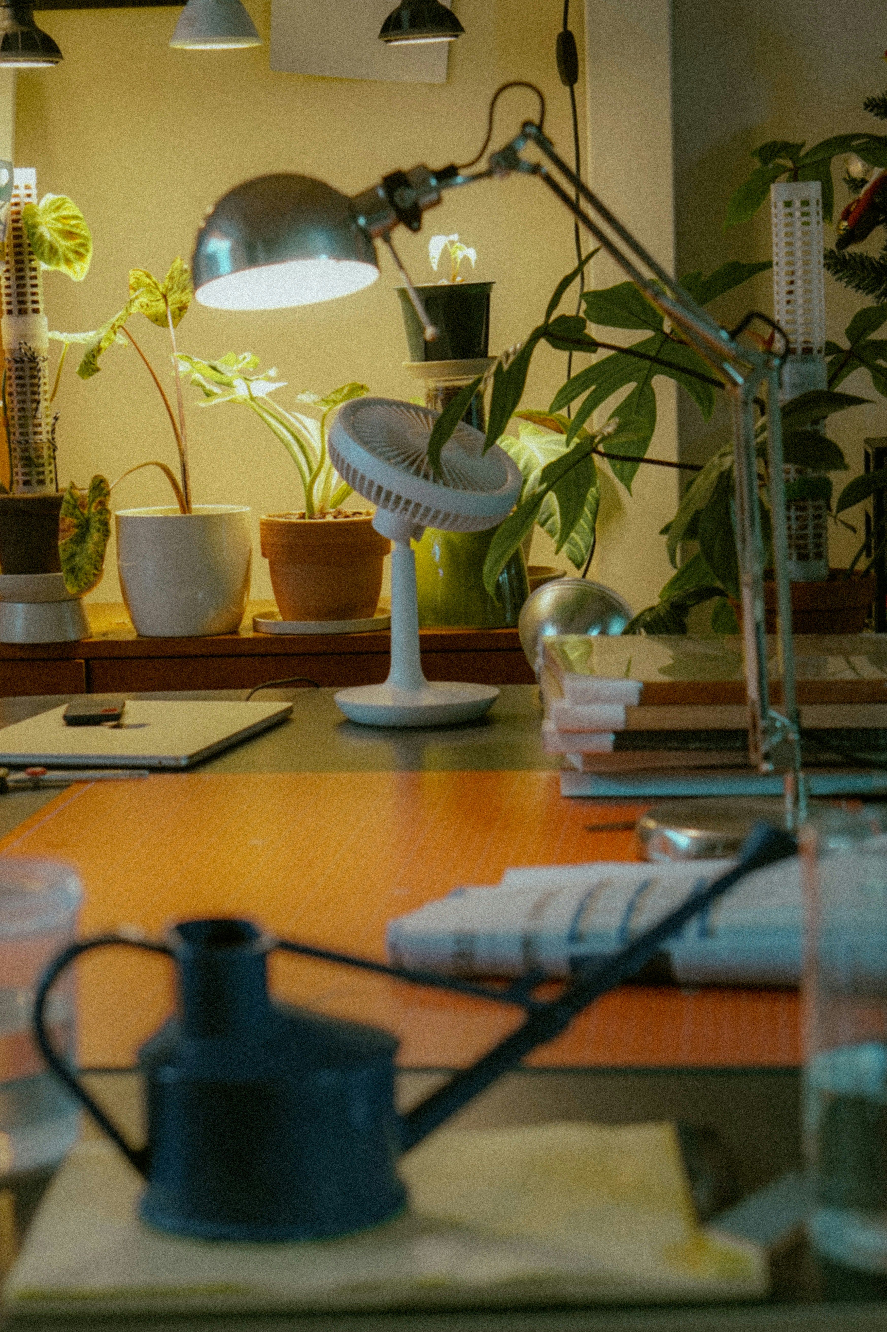 A close up of a desk with the light on