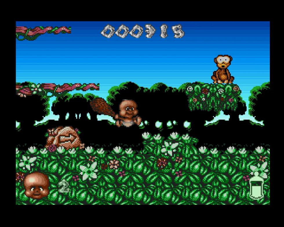 Chuck Junior attraversa un livello nella foresta in Chuck Rock II: Son of Chuck per Amiga.