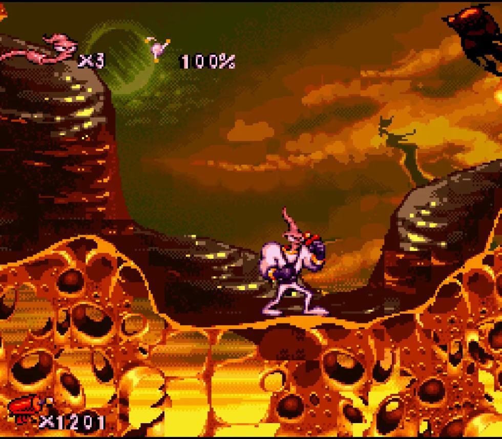 Earthworm Jim in uno scenario alieno e colorato di Earthworm Jim 2.