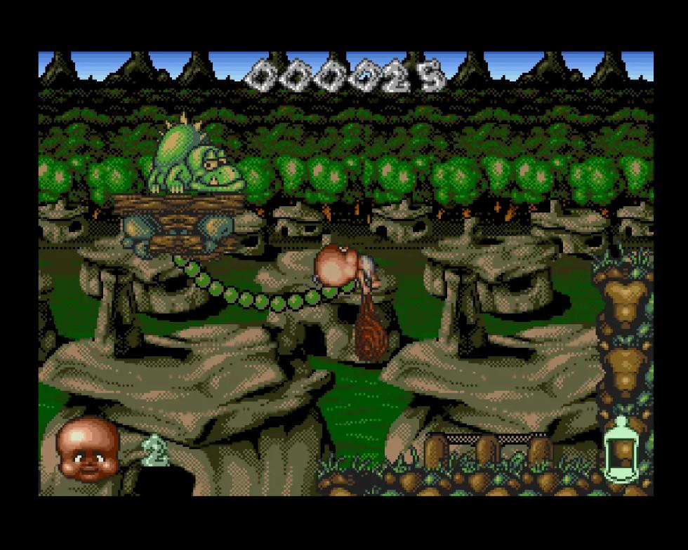 Chuck Junior usa la clava e attraversa piattaforme rocciose in Chuck Rock II per Amiga.