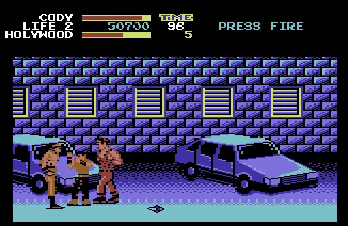 Screenshot from the Commodore 64 version of Final Fight with Cody fighting members of the Mad Gear gang.