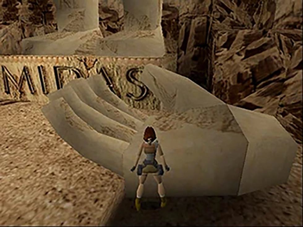 Lara Croft exploring a tomb in Tomb Raider for PlayStation.