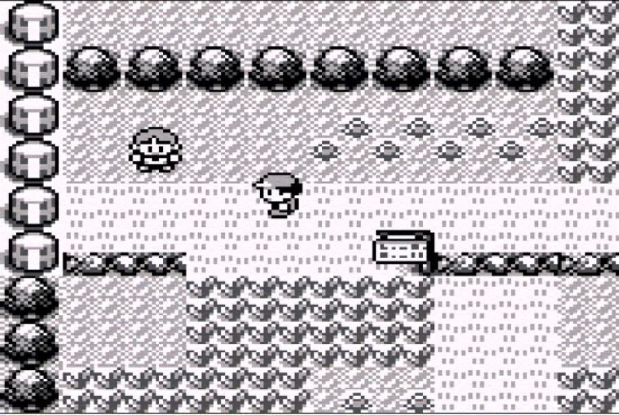 Pokémon Red su Game Boy con il protagonista e un Pokémon selvatico