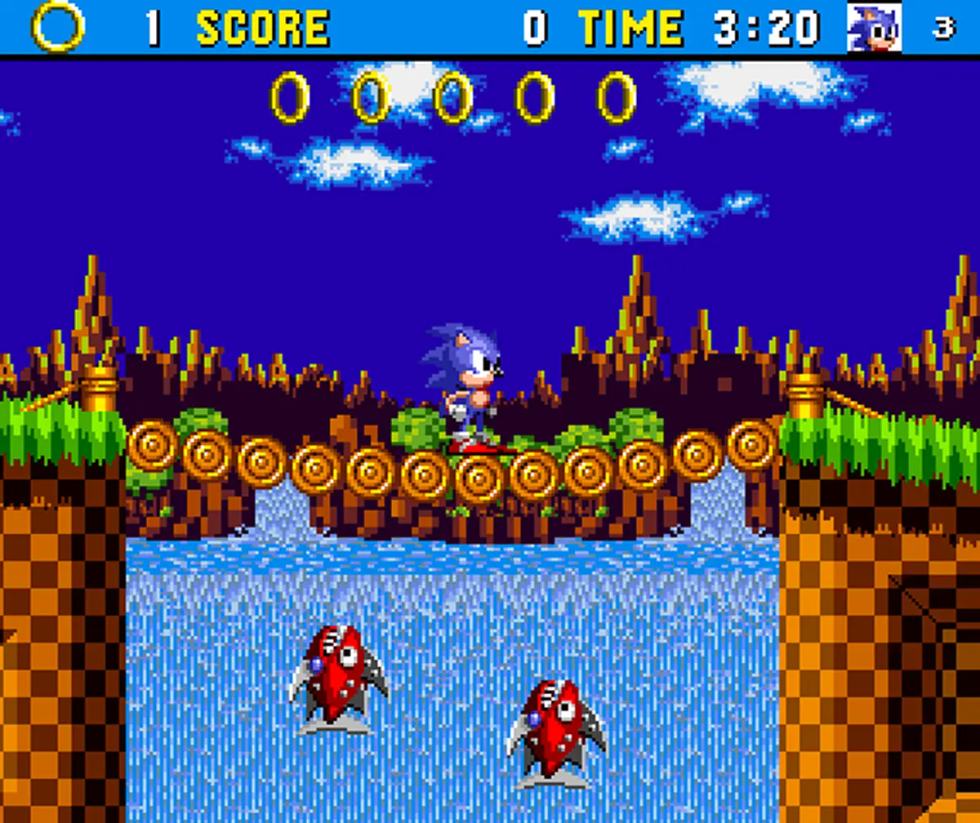 Sonic attraversa un ponte di tronchi sopra una cascata in Green Hill Zone in Aonic su Amiga 1200.