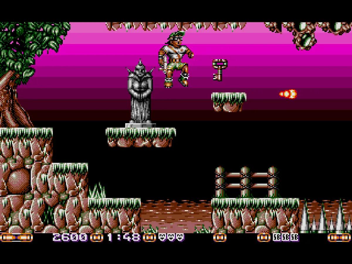 Jim Power su Atari ST, con il protagonista in uno scenario platform dalle tonalità viola e fondali a bande orizzontali.