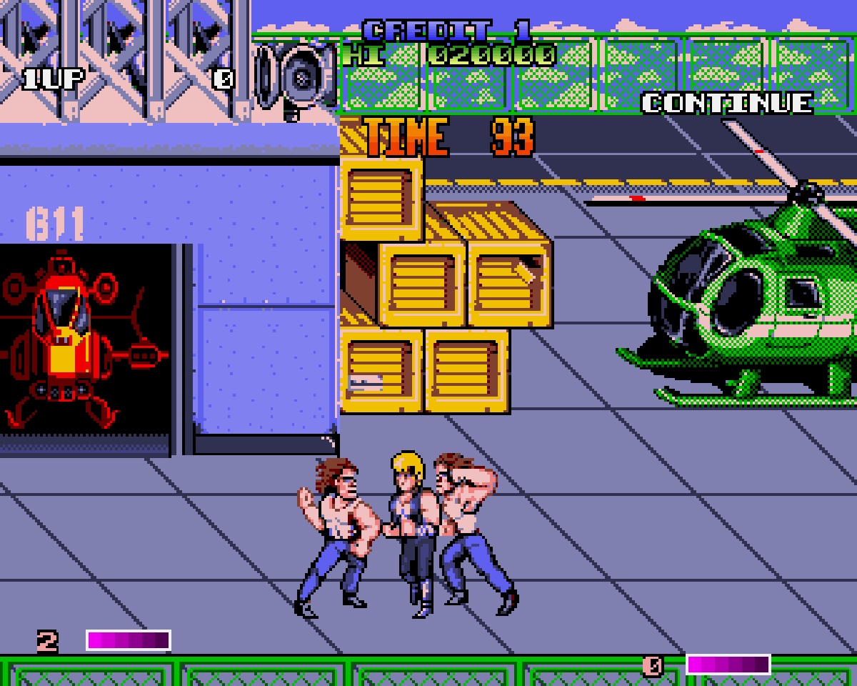 Double Dragon II su Amiga con due protagonisti circondati da nemici in un magazzino.