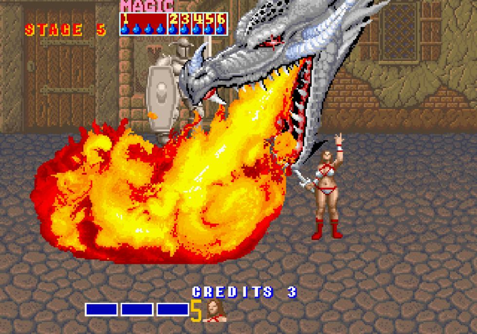 Tyris Flare magic attack in Golden Axe arcade, with a huge dragon breathing fire across the screen.