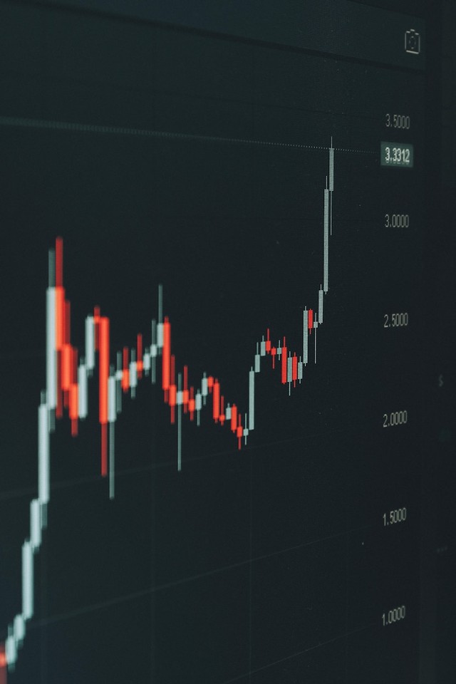 Financial trading chart rising on a dark screen