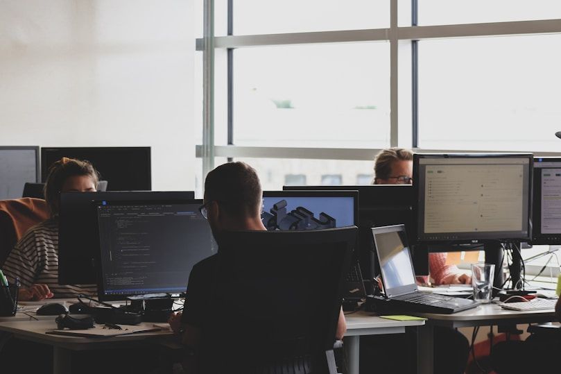 IT professionals working at computers in an office
