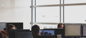 IT professionals working at computers in an office