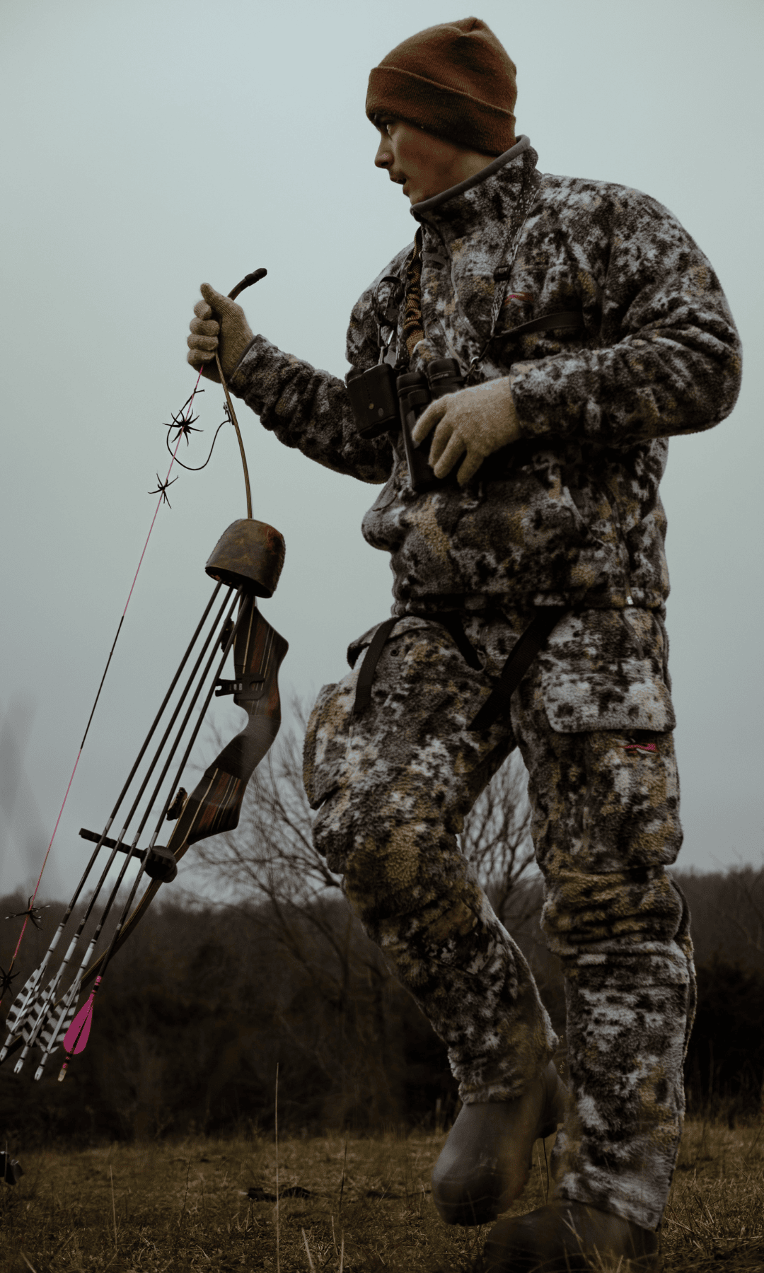 Bow hunter carrying archery equipment