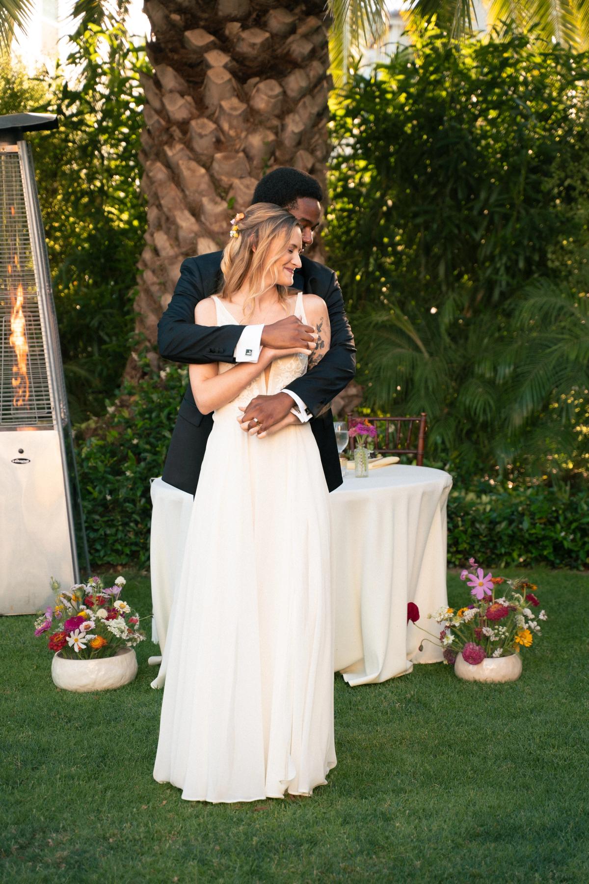 Bride and groom slow dancing during wedding reception