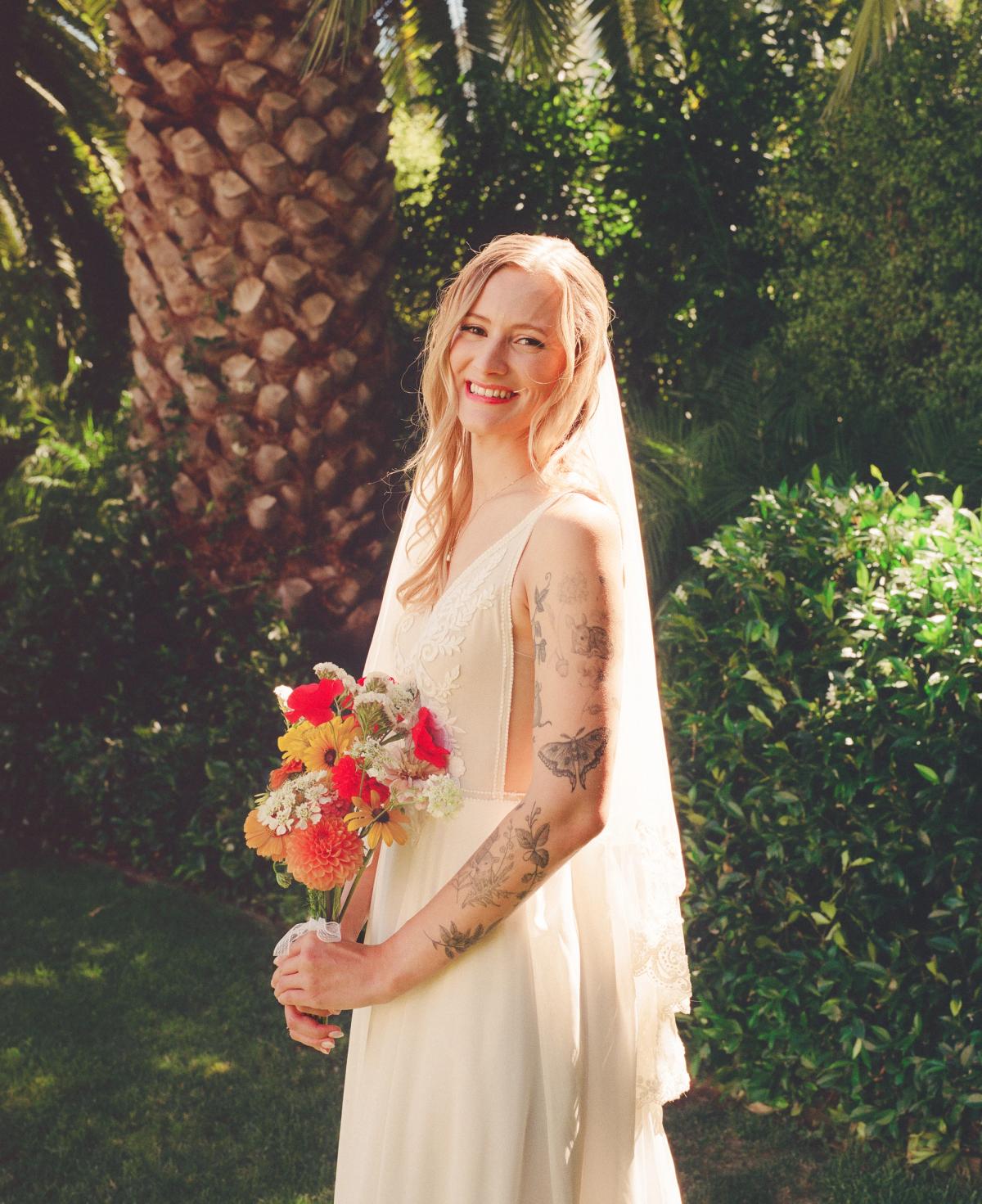 Portrait of a bride holding a bouquet of flowers at her wedding