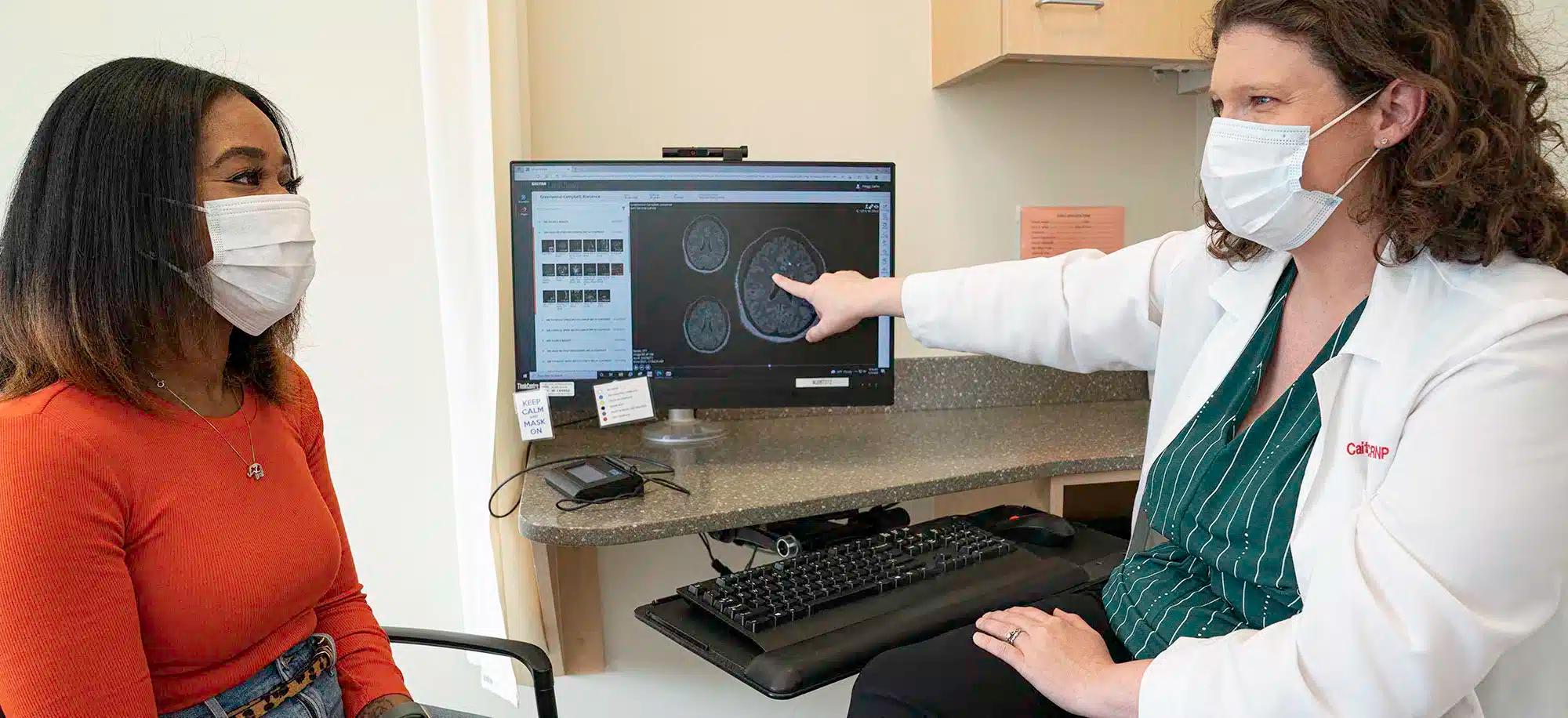 Krescence Greenwood-Campbell speaks with one of her physicians