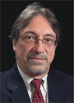 A headshot of John DeLuca
