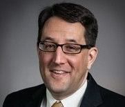 Headshot of Timothy Huskey, board member.