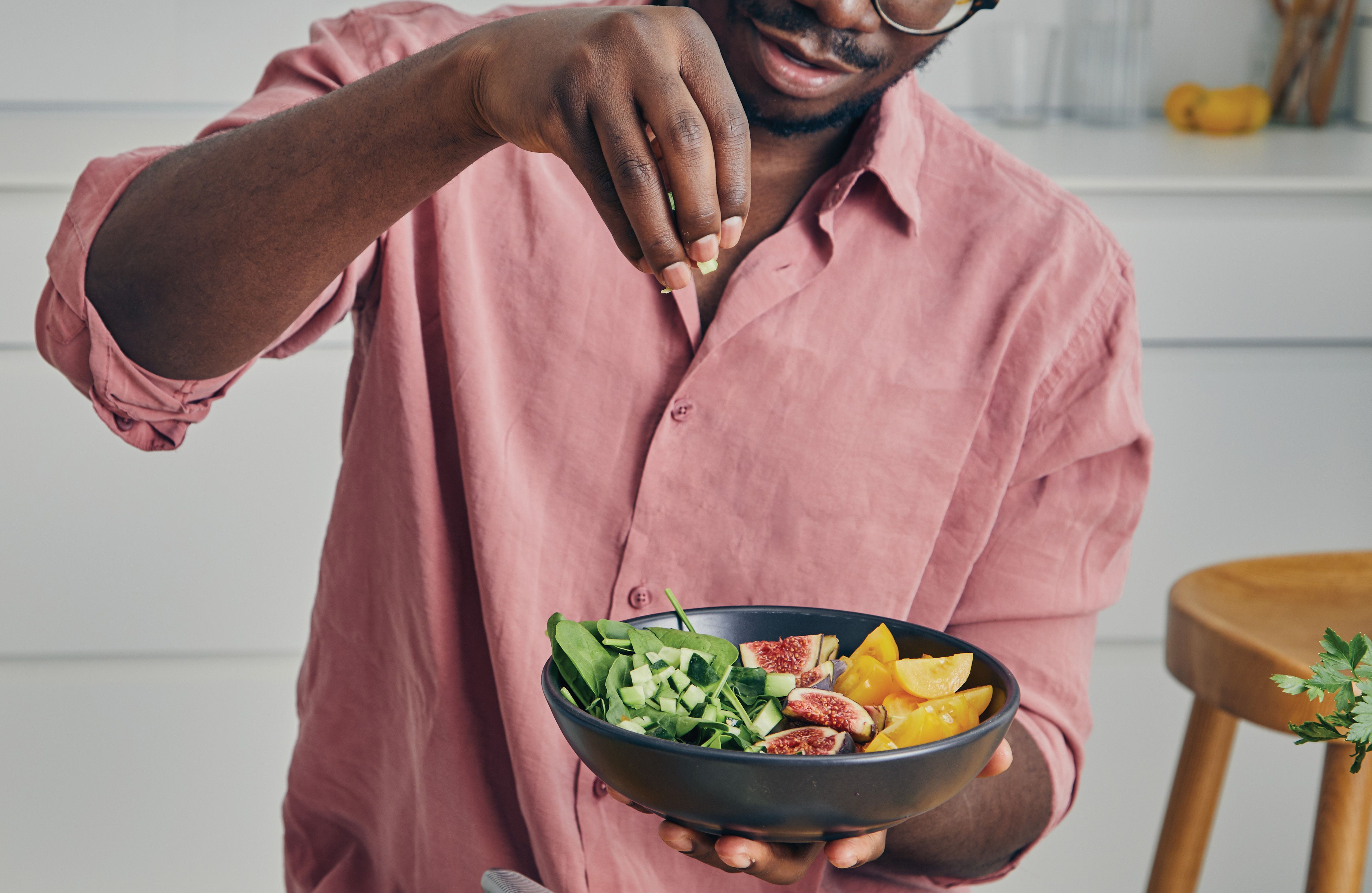 A man makes a salad.