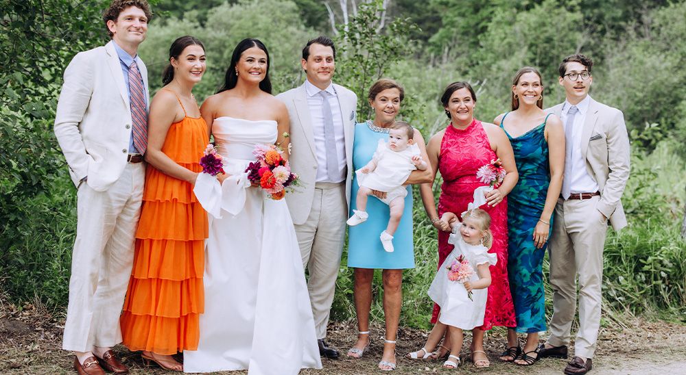 A family poses together at a wedding.