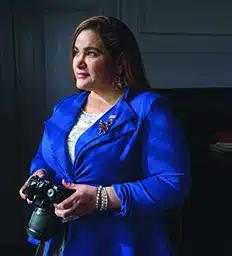 Luz Loeb holding a camera