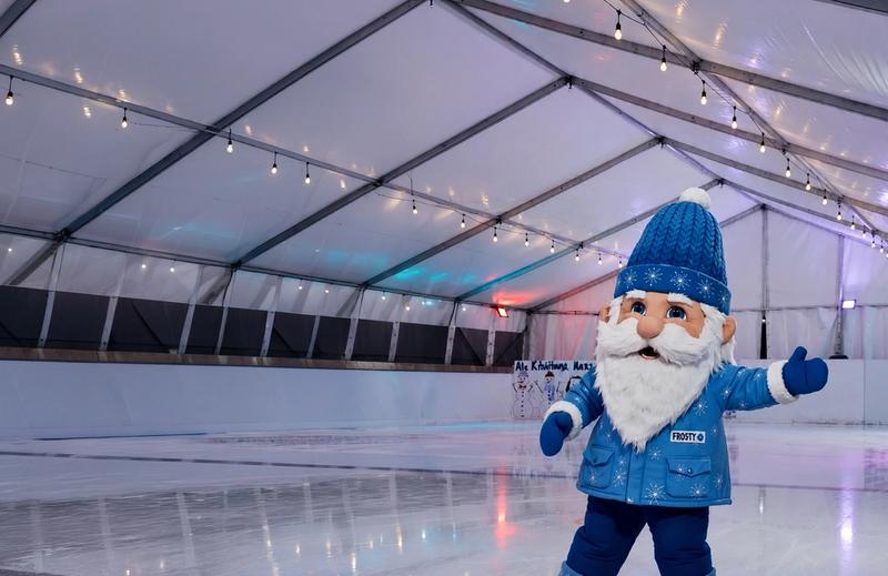 Frosty the mascot enjoying ice skating at MainPower alpine winter festival
