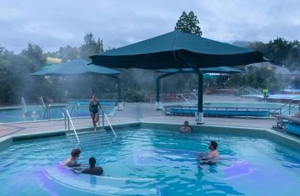 Friends together in the morning light enjoying the hexagonal pools at Hanmer Springs Thermal Pools & Spa.