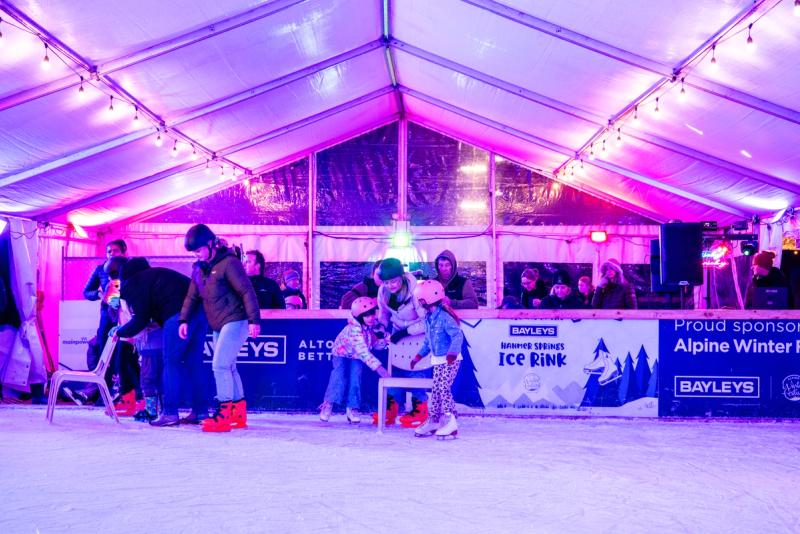 Family enjoying ice skating at MainPower alpine winter festival 