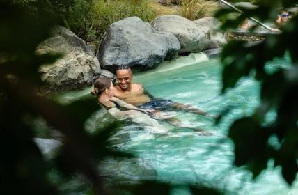 A family in the rock pool at Hanmer Springs Thermal Pools & Spa.