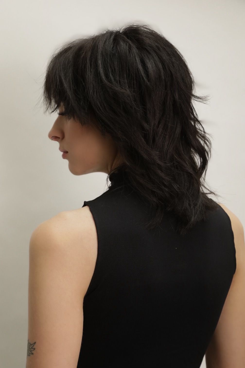 back of the head showcasing a shaggy wolf cut