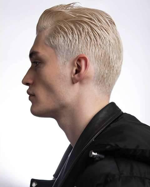 Short slicked back platinum hairstyle by Fabio Scalia
